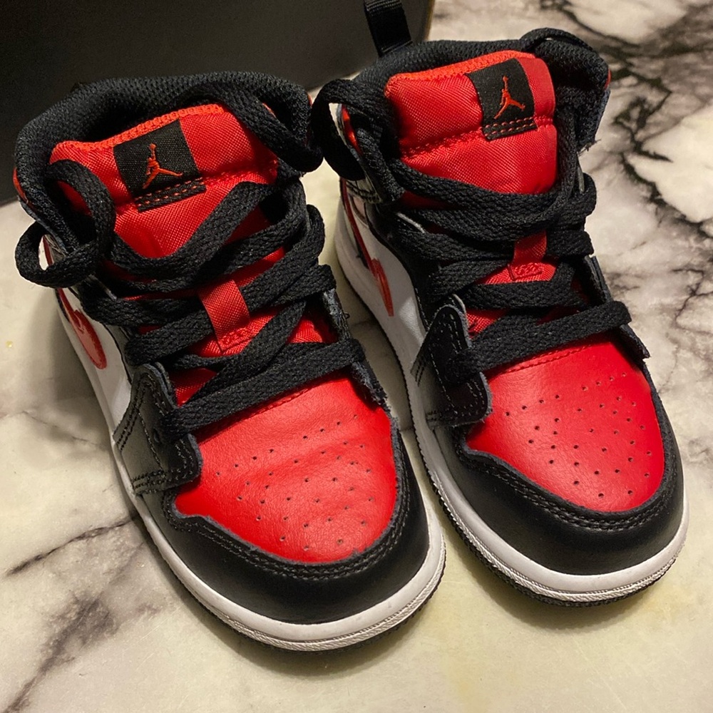 Red, black and white Jordan 1 Mid 8C